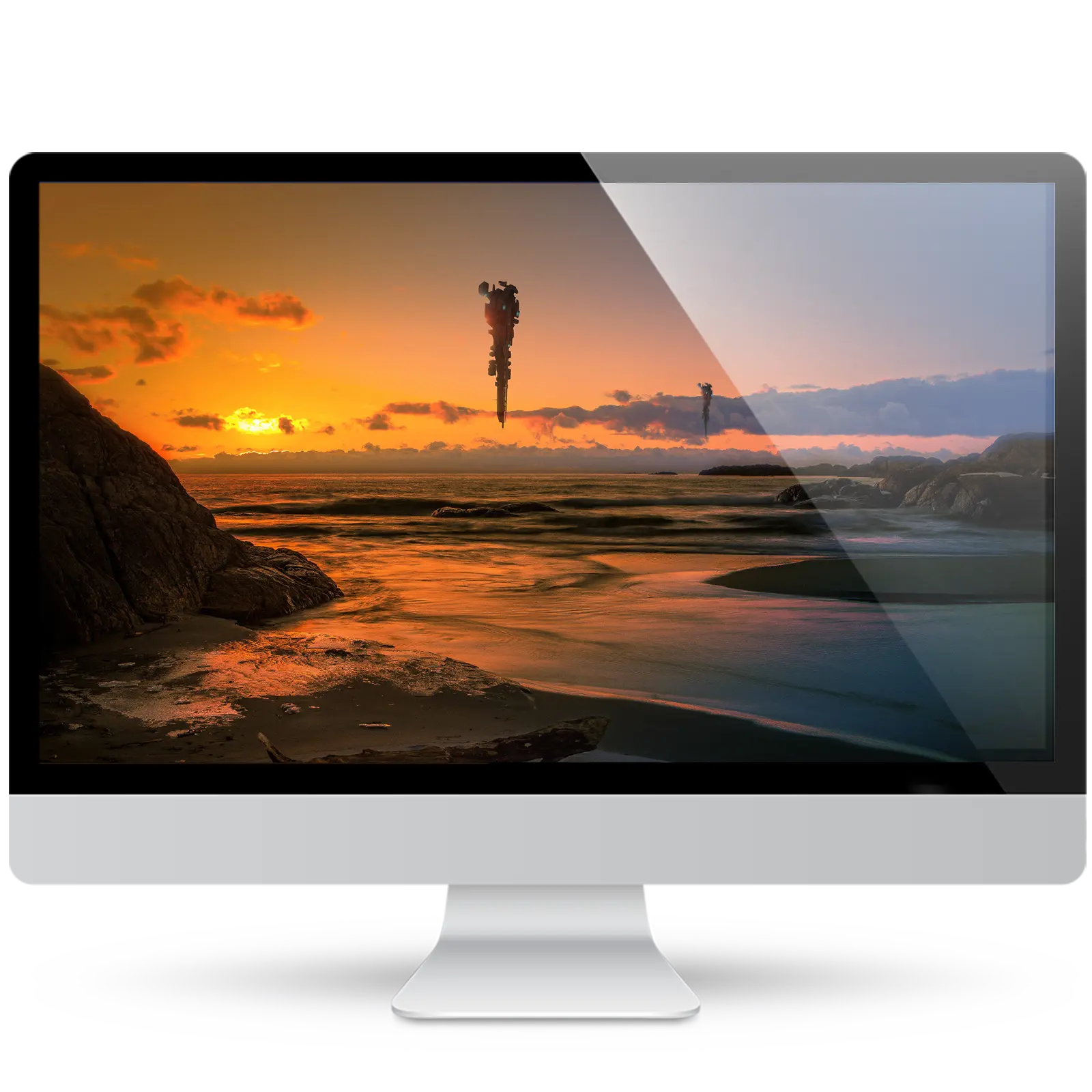 Desktop monitor showing a sci-fi wallpaper: two alien spaceships hover vertically over a rocky beach at sunset, with an orange sky and calm waves.