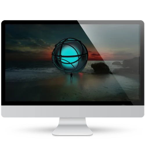 Desktop monitor showing a surreal wallpaper: a lone figure stands on a dark beach beneath a giant glowing turquoise sphere wrapped in metal rings, with a red sunset on the horizon.